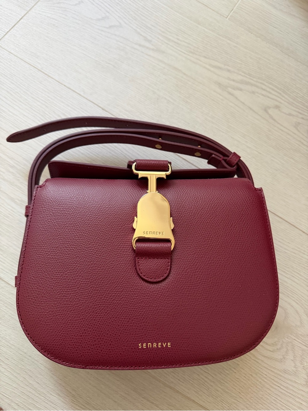 SENREVE cadence Wine Red Leather Crossbody with Gold Hardware